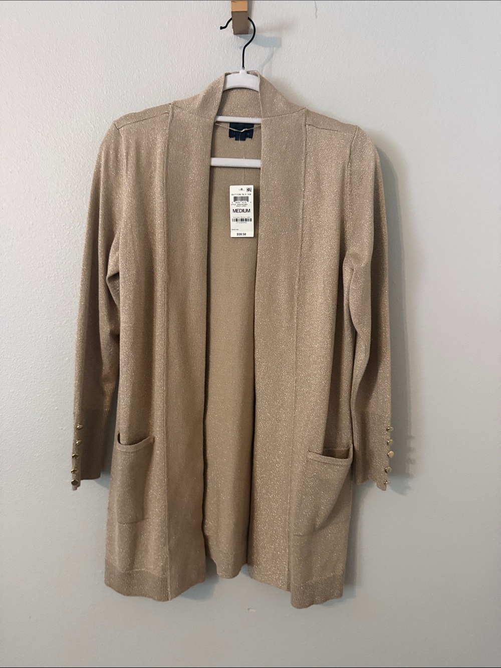 Holiday’s just got more elegant. Gold cardigan by JM.